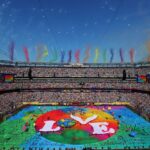 FIFA World Cup 2026 stadium filled with fans during opening ceremony featuring large LOVE banner on the field